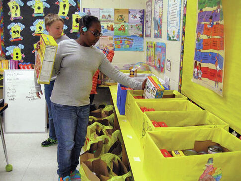 Morgan Elementary School students make Thanksgiving Boxes