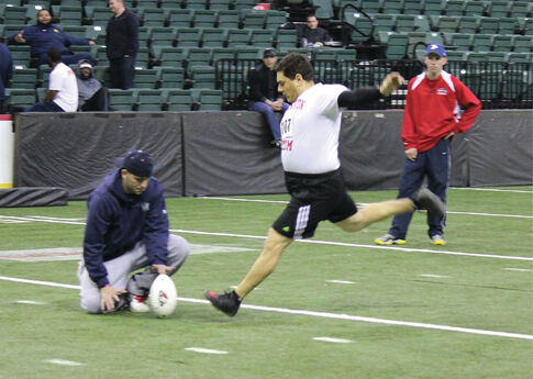 In one year, Romero goes from hospital bed to the football field