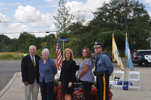 Community members gather to unveil street sign dedicated to fallen officer Negron