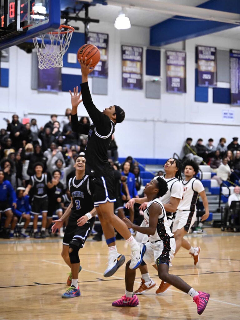 Traylor hits milestone, leads boys’ hoops